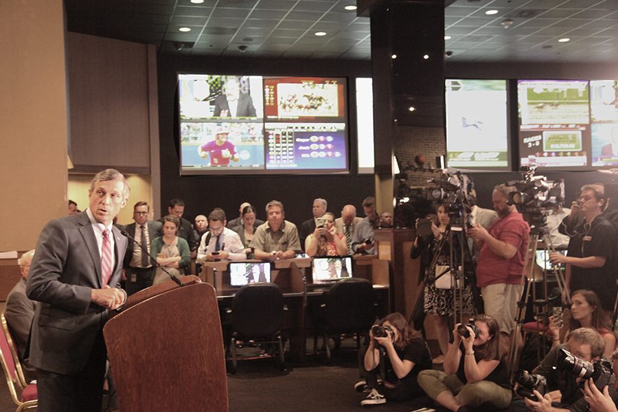 Governor John Carney speaking in front of a large crowd when he launched sports betting in the Dover Downs Sports Book.